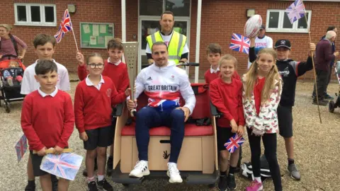 Holbrook Primary School Holbrook Primary School children with Rugby 7s Olympic athlete, Ethan Waddleton, who lives in Holbrook