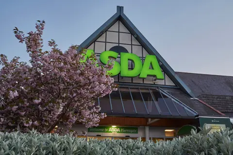 Heidi Coppock-Beard A view of an Asda sign and a blossom tree