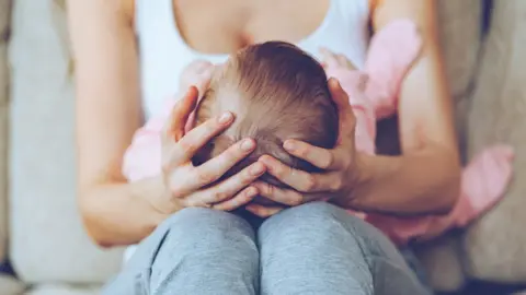 Getty Images Mum and newborn baby