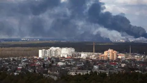 Reuters Smoke rising over outskirts of Kyiv