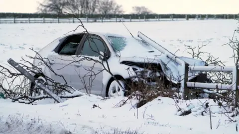 PA Media A crashed car on the A68 near Castleside in County Durham