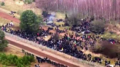 Aerial view of hundreds of migrants on Belarus' border with Poland