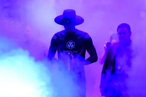 Getty Images Israel Adesanya of Nigeria walks to the Octagon in the UFC middleweight championship fight during the UFC 276 event at T-Mobile Arena on July 02, 2022 in Las Vegas, Nevada.