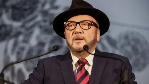 Reuters Candidate George Galloway, leader of the Workers Party of Britain, speaks after winning the Rochdale Parliamentary by-election.