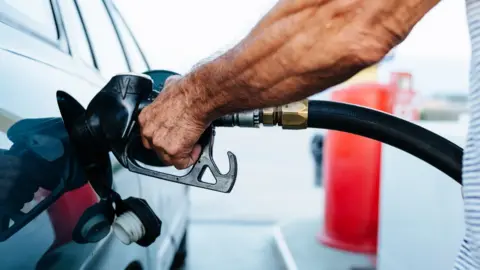 Getty Images Man filling up with diesel