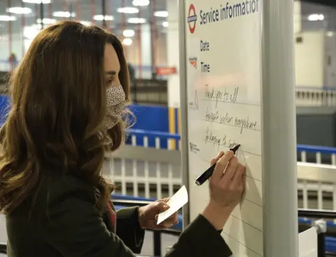 Kensington Palace Kate writing a message to transport workers