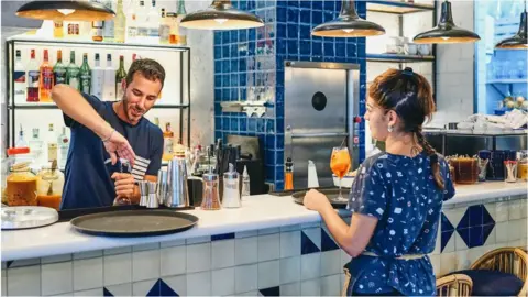 Getty Images Working in a bar in Spain
