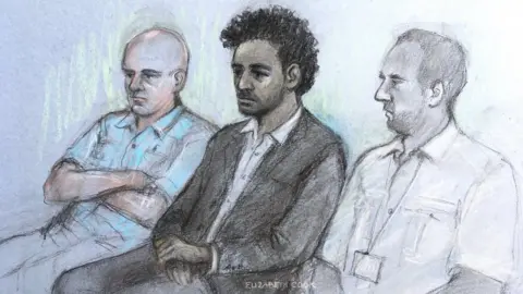 Elizabeth Cook / PA A sketch of Callum Wheeler (centre) in court at the opening of the trial