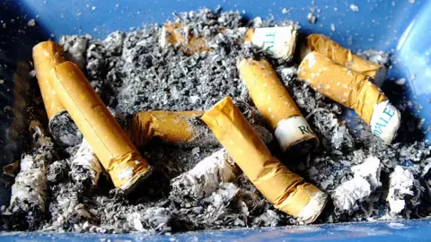 Getty Images Cigarettes in ash tray