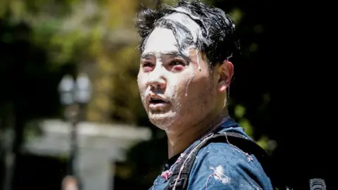 Getty Images Conservative journalist Andy Ngo was attacked by far left demonstrators