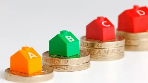 Getty Images Council tax houses on coins