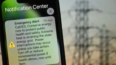 Getty Images Picture of phone with emergency alert message