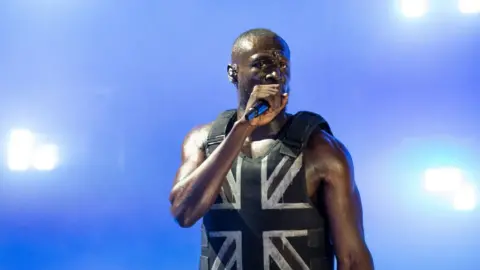 PA Media Stormzy on stage at Glastonbury