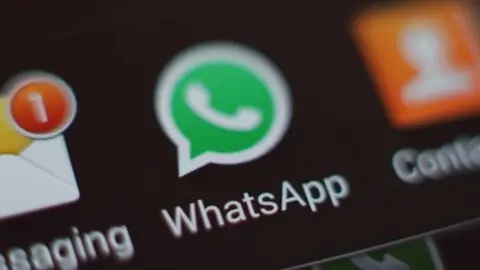 PA The WhatsApp icon on the screen of a smartphone (27 March 2017)