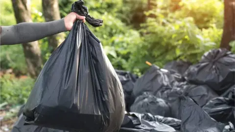 Getty Images Black bin bagpile