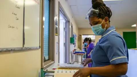 Getty Images Nurse with records