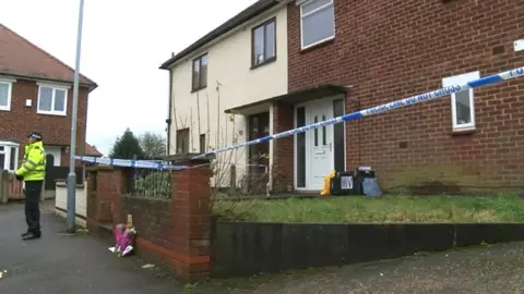 BBC Police cordon off a house on Strathmore Close in Hucknall, Nottinghamshire