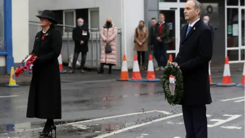 PA Media/Brian Lawless Arlene Foster and Micheál Martin on Remembrance Sunday