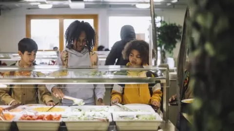 Getty Images Kids get school lunches