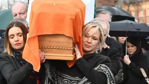 Pacemaker Press Michelle O'Neill carries the coffin of the late Martin McGuinness in 2017