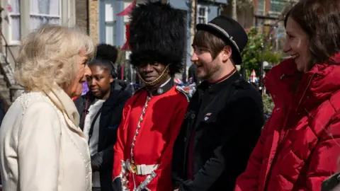 PA Media The Duchess of Cornwall with Ben Champniss during a visit to the set of EastEnders