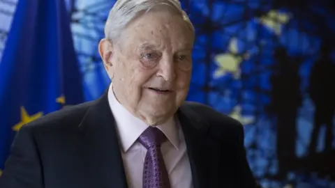 EPA George Soros, pictured in front of EU flag in April 2017