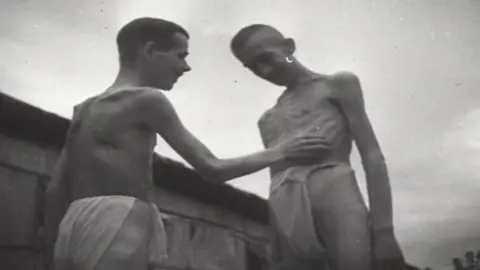 British Pathe Two starving prisoners of war in loin cloths
