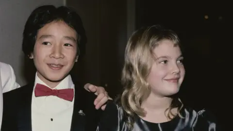 Getty Images Ke Huy Quan and Drew Barrymore at the 6th Youth in Film Awards, in Los Angeles, California, 2nd December 1984