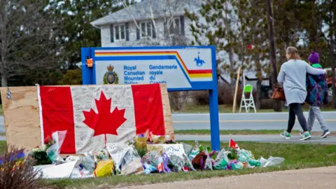 Getty Images Vigil outside RCMP office in Nova Scotia