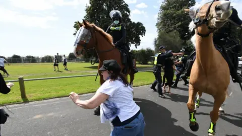 EPA Police try to intercept protesters during an anti-lockdown protest in Melbourne, Australia, 19 September 2020