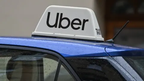 Getty Images Logo of Uber seen on a car