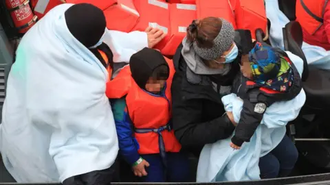 PA Media Baby and child at Dover