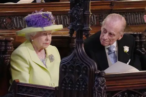 PA Queen Elizabeth II and Prince Phillip during the wedding service