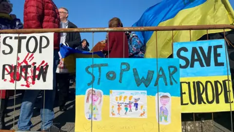 Posters saying 'stop the war'