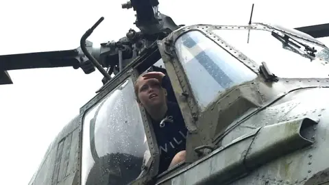 Dave Dillon Mikyla Dillon, then aged 17, looking out of the window of the helicopter cockpit