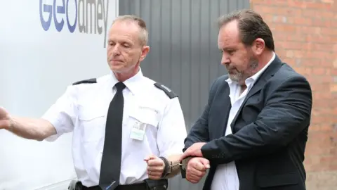 Yui Mok/PA Monaghan being led to a prison van