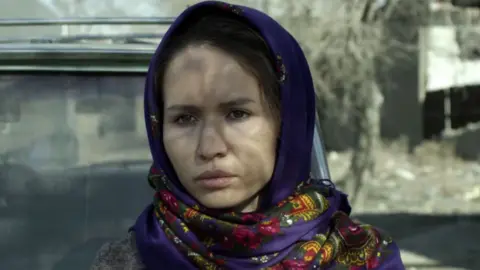 Studio Soho Woman about to make journey