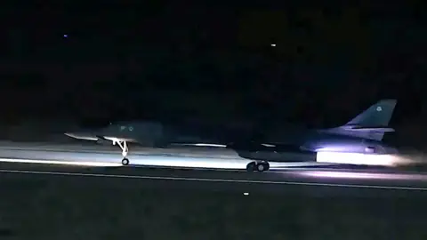 US Central Command A B-1 bomber taking off from a runway in the dark