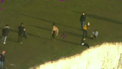 NPAS People near the edge of the cliffs at Beachy Head