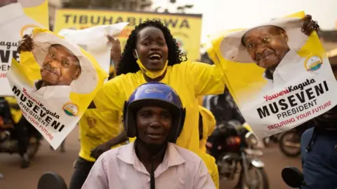 Getty Images Celebrating Yoweri Museveni's victory