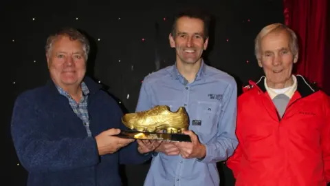 Dai Richards Max Boyce giving out awards in 2015 with the founder, Arthur Phillips (Right).