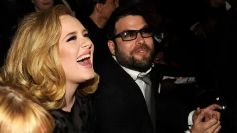 Getty Images Adele and Simon Konecki at the Grammy Awards in 2013