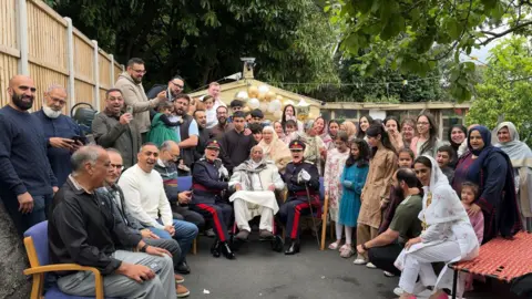 BBC / Sabbiyah Pervez Mirza Khan celebrating his 103rd birthday with his family, which includes his six children, 21 grandchildren and 24 great grandchildren.