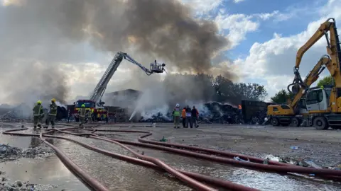 Crews busy on the scene of a waste fire