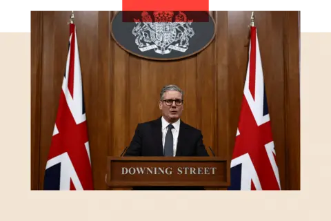 PA Media Starmer at a Downing Street podium giving a speech 