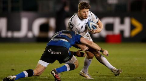 Ed Slater in action with Bath’s Tom Dunn