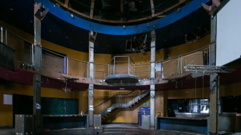 Empty nightclub with a balcony and domed ceiling