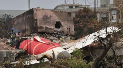 Reuters Members of Indian Army's engineering arm prepare to remove the wreckage of an Air India aircraft, bound for London's Gatwick Airport, which crashed during take-off from an airport in Ahmedabad, India June 14, 2025. REUTERS/Amit Dave