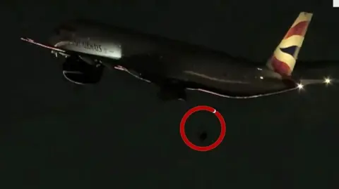 Moment the plane's rear wheel falls off just after take-off