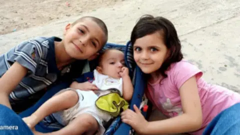 al-Najjar family Adam al-Najjar (left), the sole surviving child of the al-Najjar family, pictured with his sisters Sidra (center) and Rival (right), who were both killed in an Israeli airstrike.
